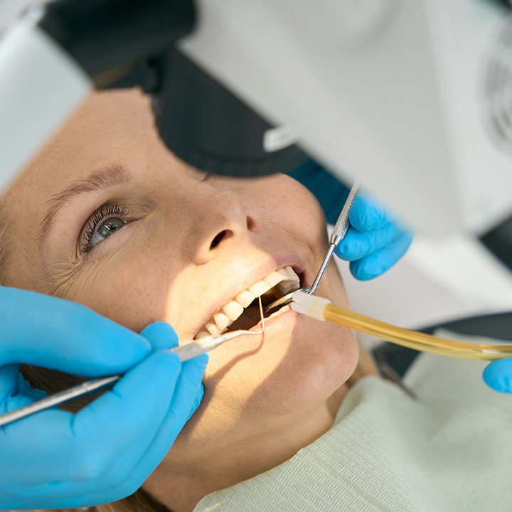Woman receiving dental extraction treatment in Stafford, VA
