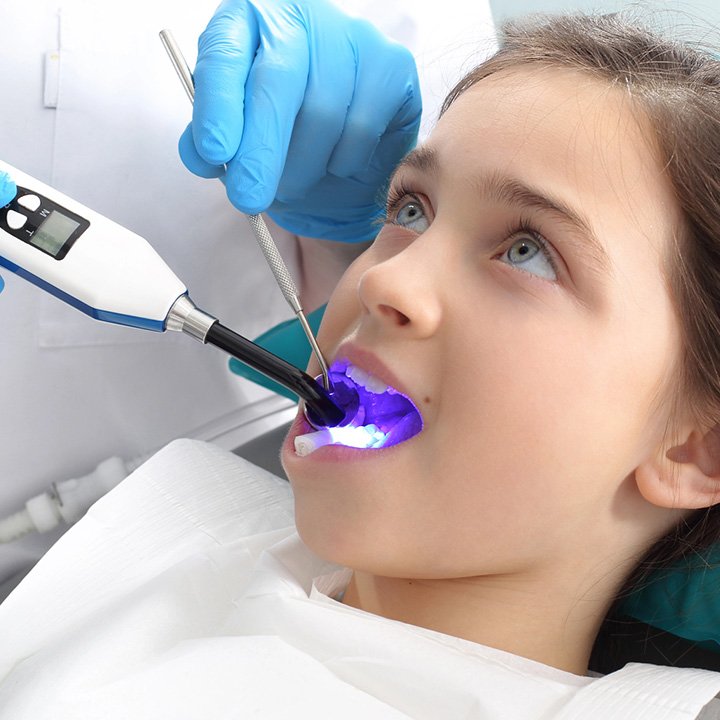 Child receiving dental sealants procedure in Stafford, VA