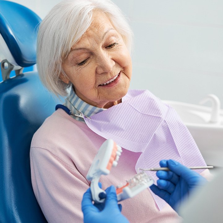 Dentist educating a patient about dental implant treatment in Stafford, VA