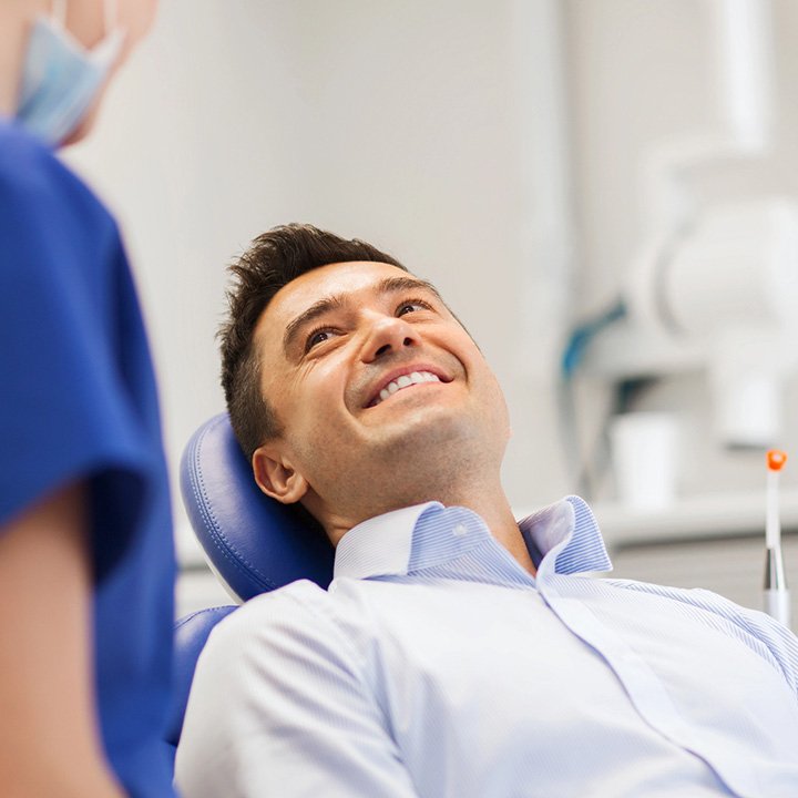 Happy man after receiving emergency dental treatment in Stafford, VA
