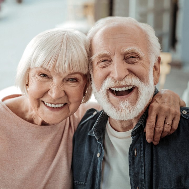 Happy senior couple after receiving dental extraction in Stafford, VA