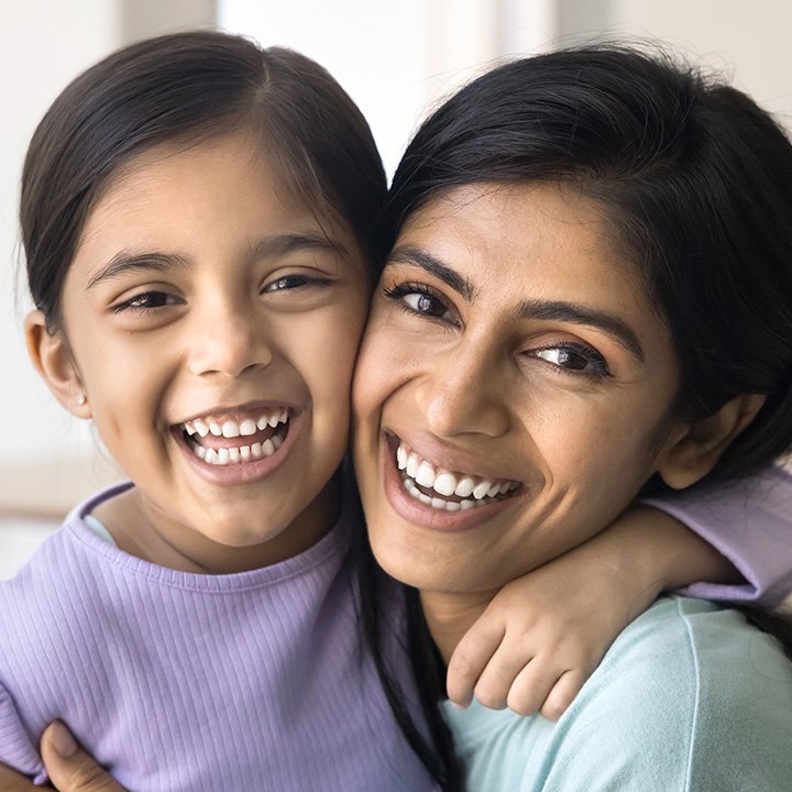Happy mother and child smiling after dental bonding treatment in Stafford, VA